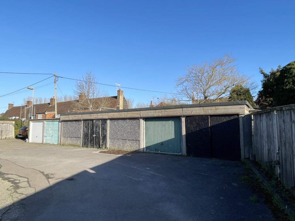 Lot: 65 - COMPOUND OF NINETEEN GARAGES AND LAND - Seven of nineteen garages in village